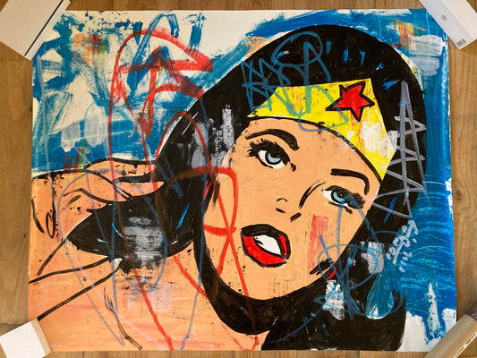 “Wonder Woman” (2024) by Freda People reinterprets this legendary icon through the lens of modern pop and urban art. For sale on FLIP Gallery