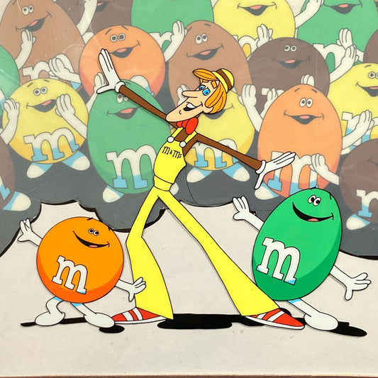 A magical set of 4 original animation cels, carefully assembled in a vintage mat board, forming a complete scene from a 1970s U.S. M&M’s commercial. For sale on FLIP Gallery
