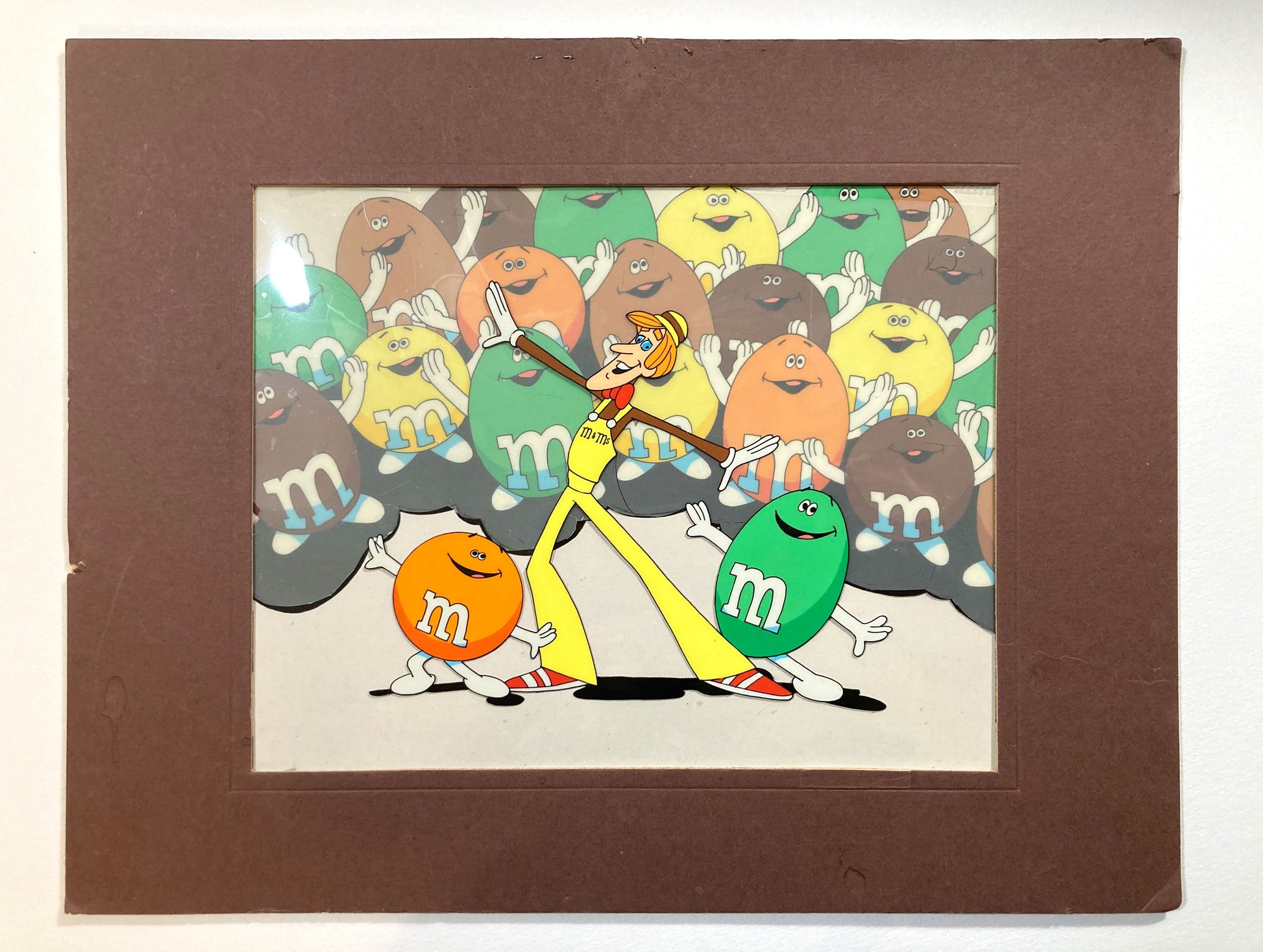 A magical set of 4 original animation cels, carefully assembled in a vintage mat board, forming a complete scene from a 1970s U.S. M&M’s commercial. For sale on FLIP Gallery