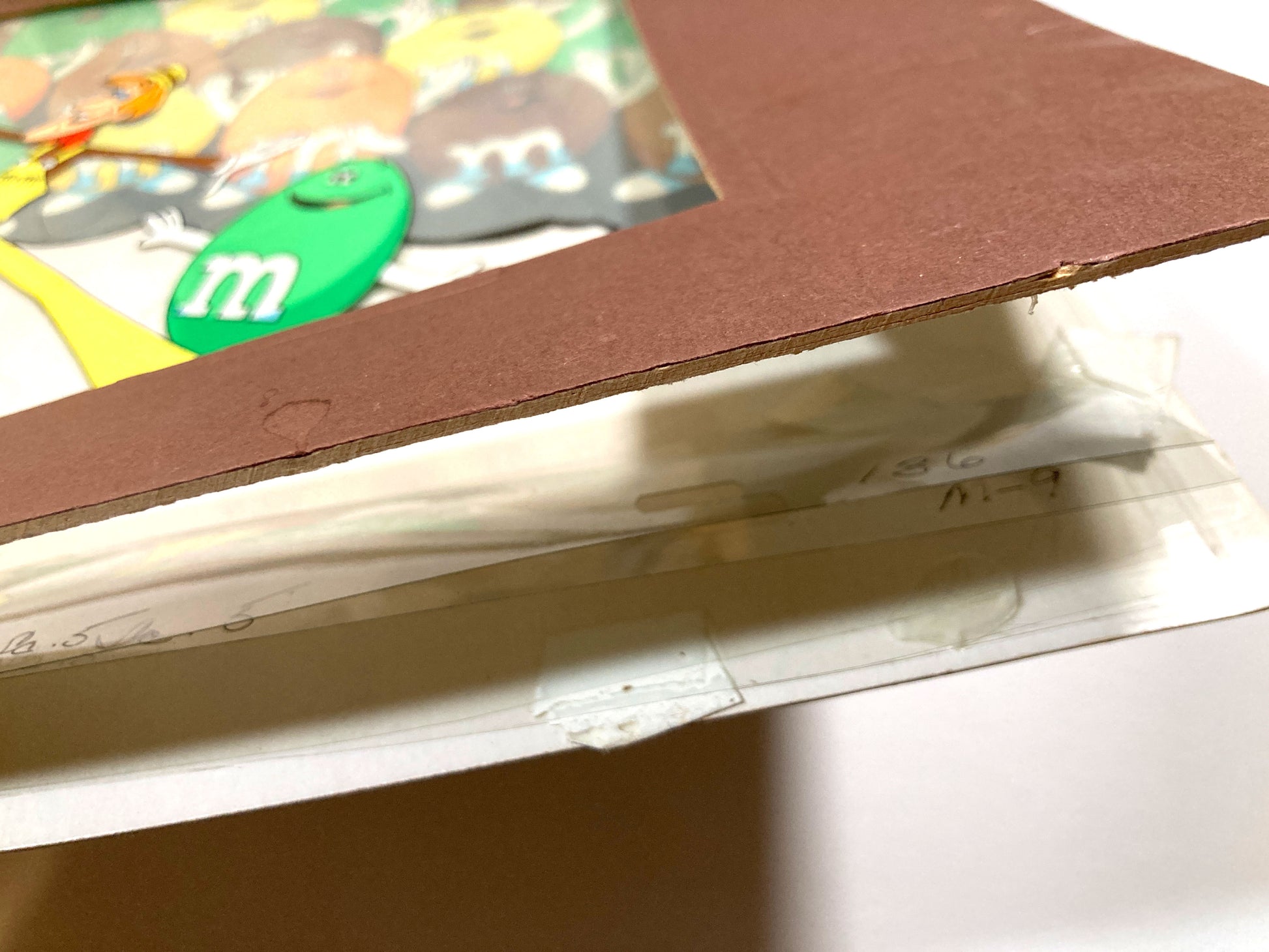 A magical set of 4 original animation cels, carefully assembled in a vintage mat board, forming a complete scene from a 1970s U.S. M&M’s commercial. For sale on FLIP Gallery