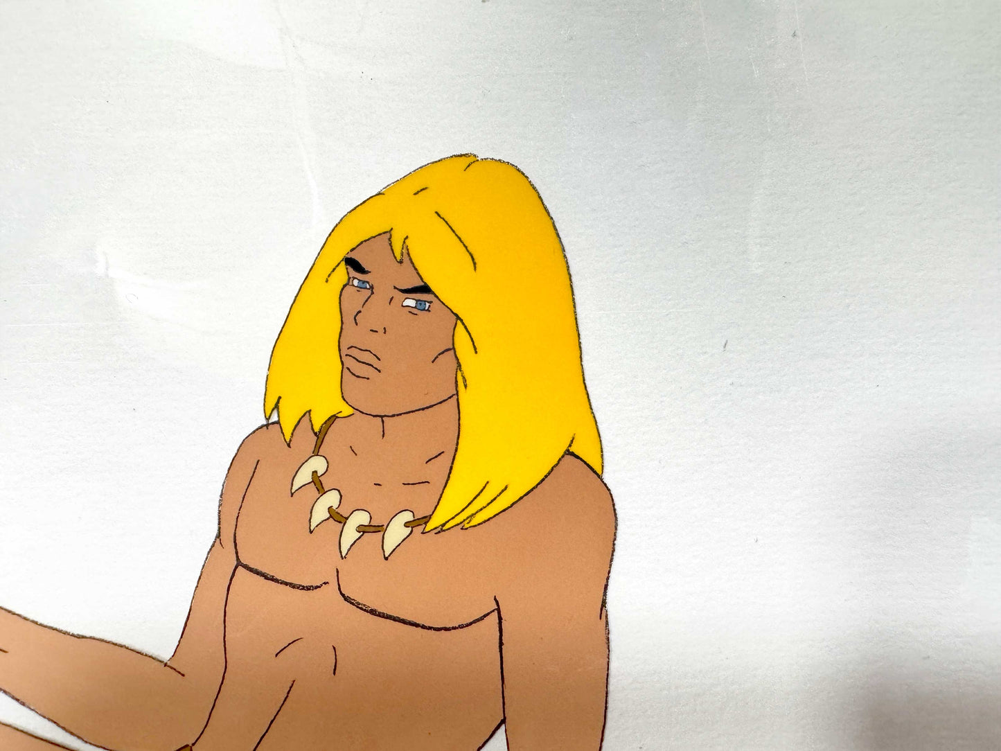 An original hand-painted production cel featuring Rahan, the iconic prehistoric hero from the classic animated series based on the famous French comic created by Roger Lécureux and André Chéret. For sale on FLIP Gallery