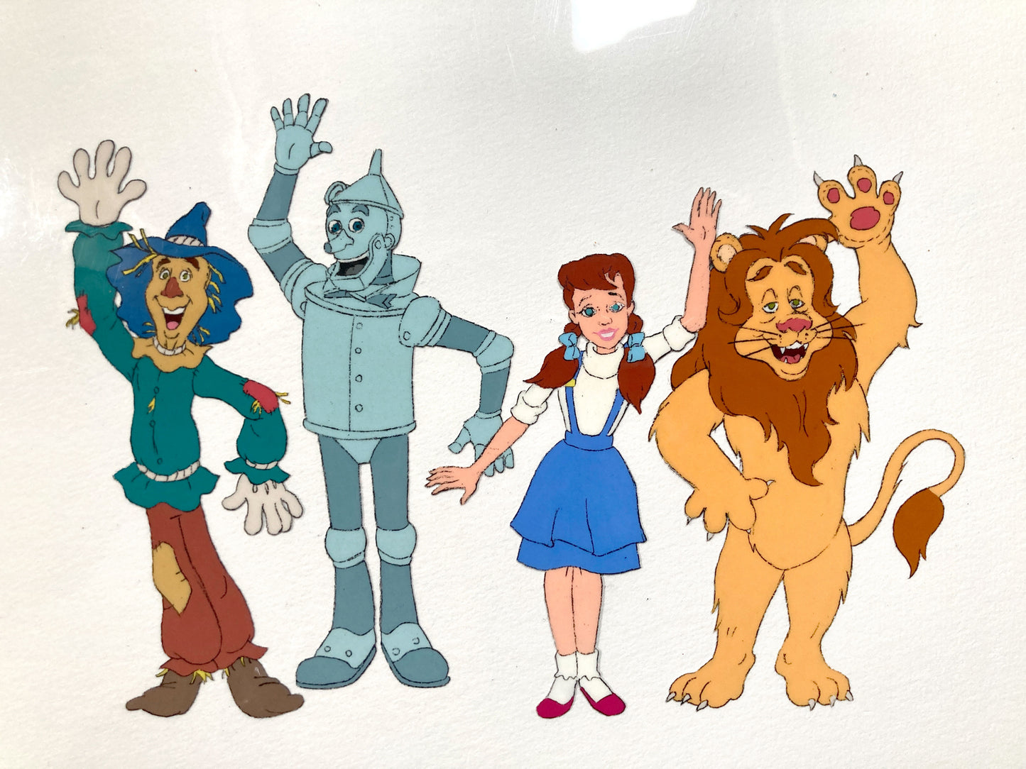 The Wizard of Oz : Dorothy, Scarecrow, Cowardly Lion, and Tin Man Original Production Cel with Matching Animation Drawing (TV Series, 1990). For sale on FLIP Gallery