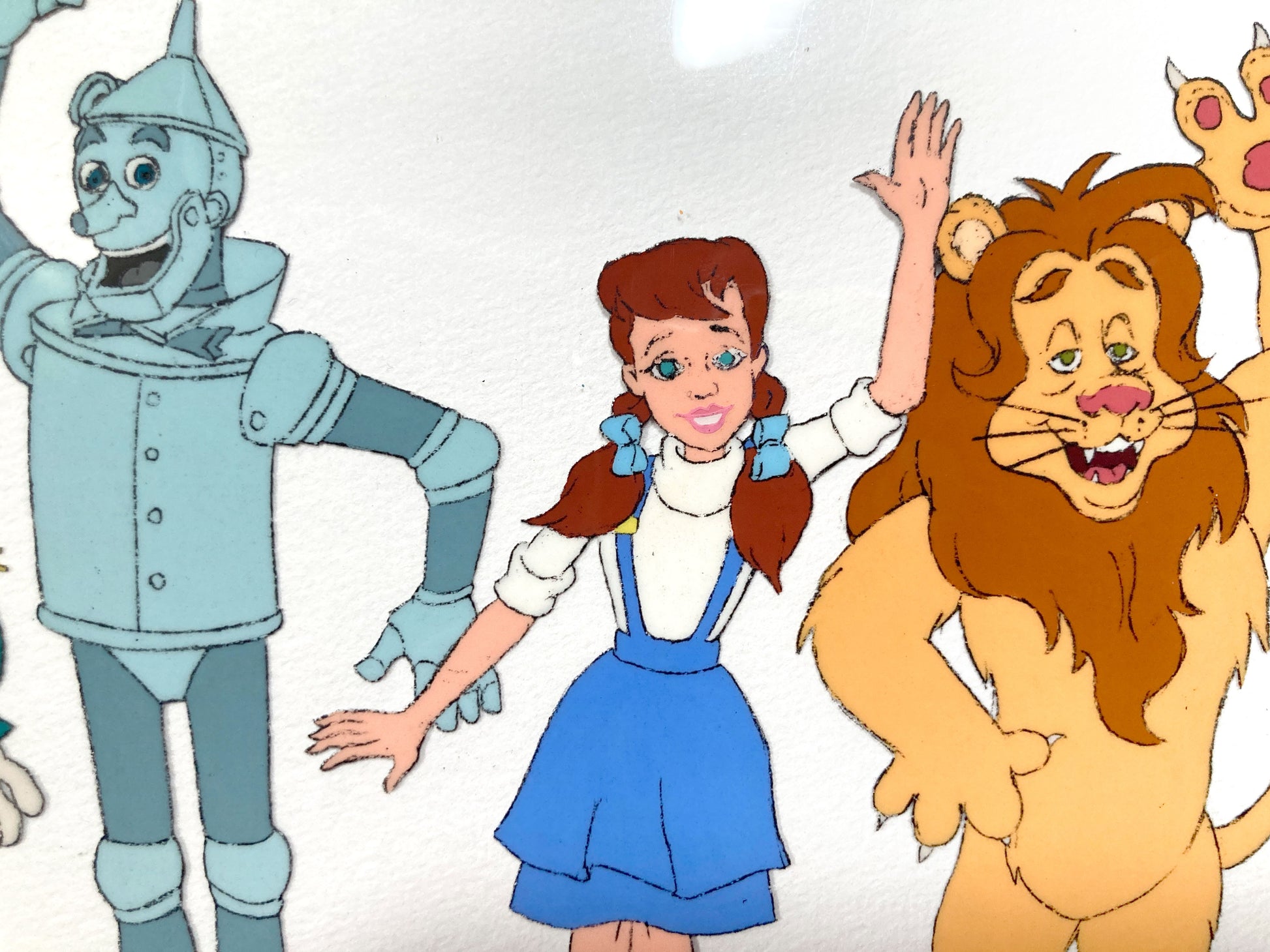 The Wizard of Oz : Dorothy, Scarecrow, Cowardly Lion, and Tin Man Original Production Cel with Matching Animation Drawing (TV Series, 1990). For sale on FLIP Gallery